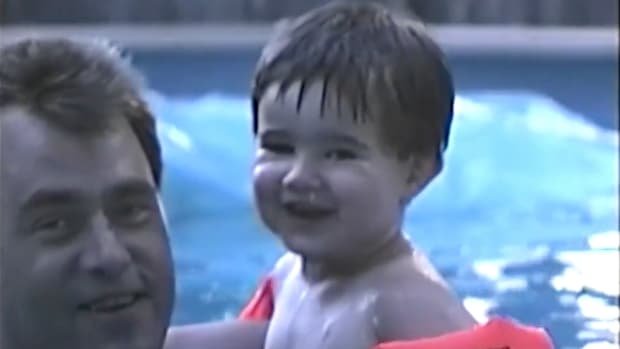 Screenshot from childhood video of Jason Kelce showing him in the pool as a toddler